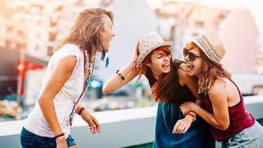 3 girls talking and laughing