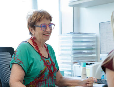 Dr Liz Farrell talking to a patient