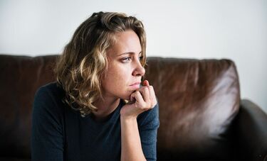 Woman sitting looking aside