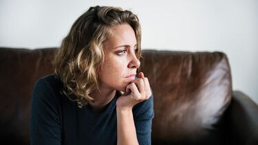 Woman sitting looking aside