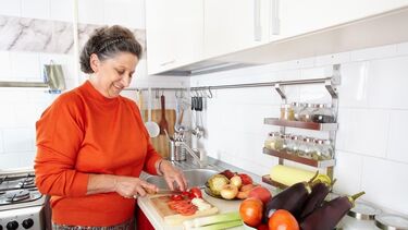 A woman preparing food in the kitchen